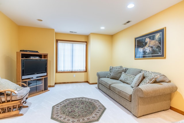 living area with recessed lighting, visible vents, baseboards, and carpet