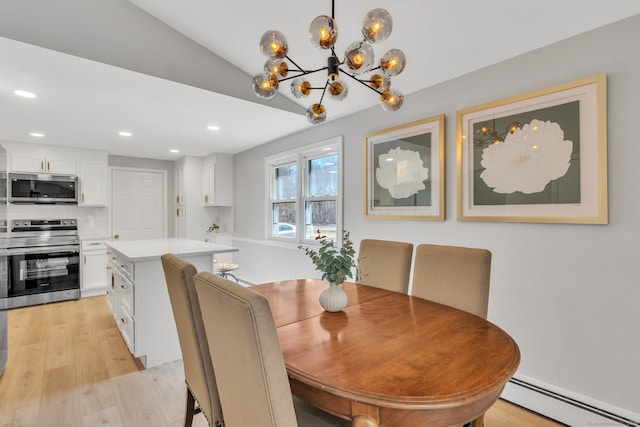 dining room with recessed lighting, light wood-type flooring, and baseboard heating