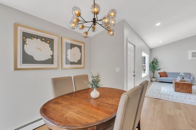 dining room featuring recessed lighting, light wood-style floors, baseboard heating, and vaulted ceiling