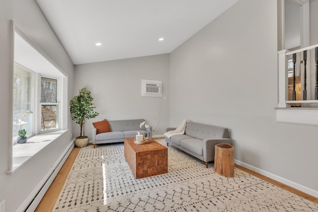 living room with wood finished floors, baseboards, recessed lighting, vaulted ceiling, and baseboard heating