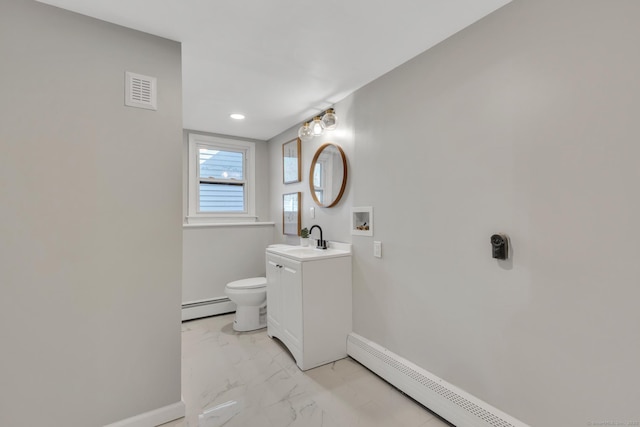 bathroom with baseboards, baseboard heating, marble finish floor, and toilet