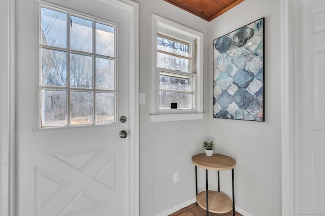 doorway with tile patterned flooring