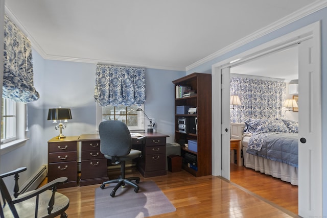 office space with light wood-style flooring and ornamental molding