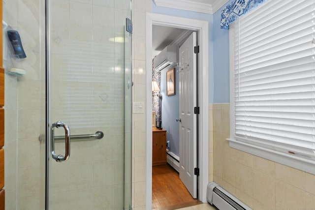 bathroom featuring baseboard heating, tile walls, a stall shower, and ornamental molding