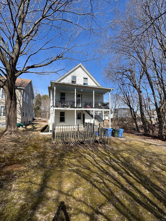 view of front of property with covered porch and a front yard