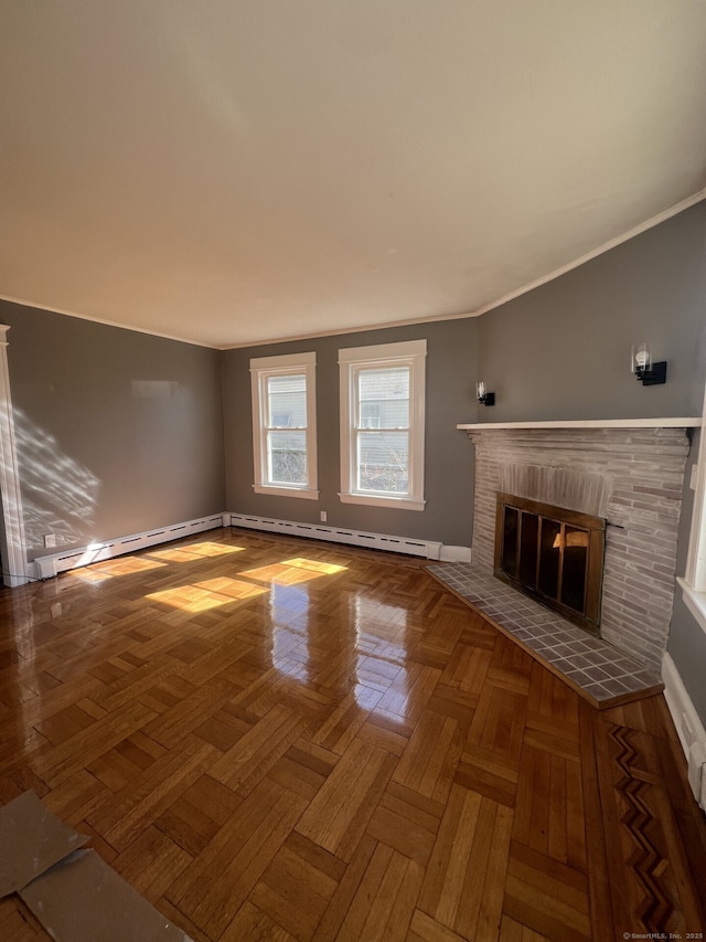 unfurnished living room with a fireplace, a baseboard heating unit, baseboards, and ornamental molding