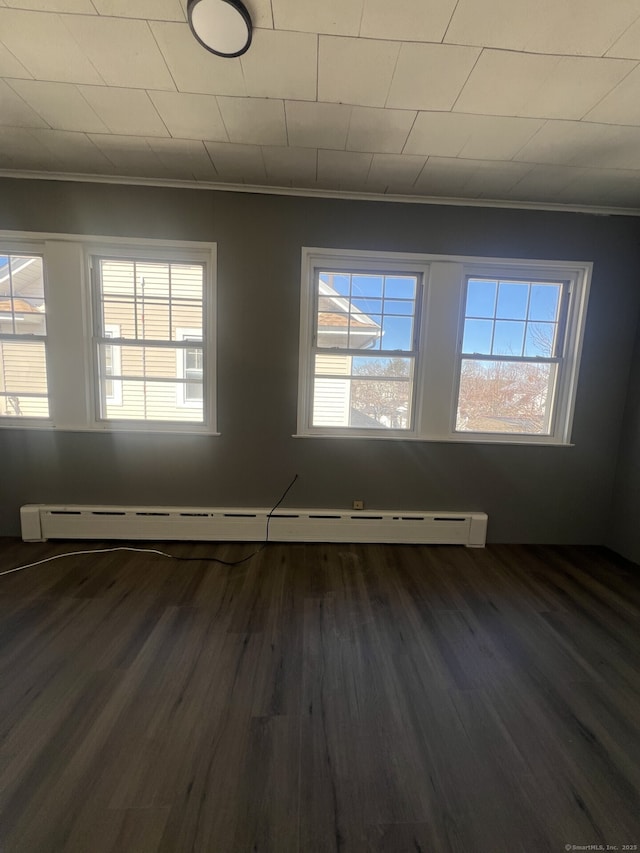 112 Concord St, Waterbury, CT 06710 - spare room with ornamental molding, baseboard heating, and a healthy amount of sunlight