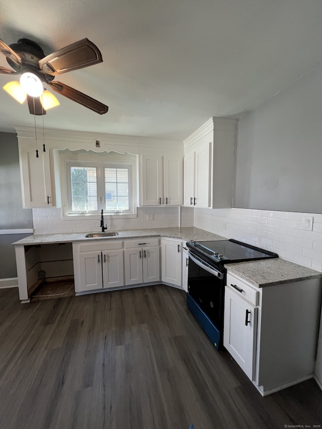 112 Concord St, Waterbury, CT 06710 - kitchen featuring white cabinetry, tasteful backsplash, black electric range, and a sink