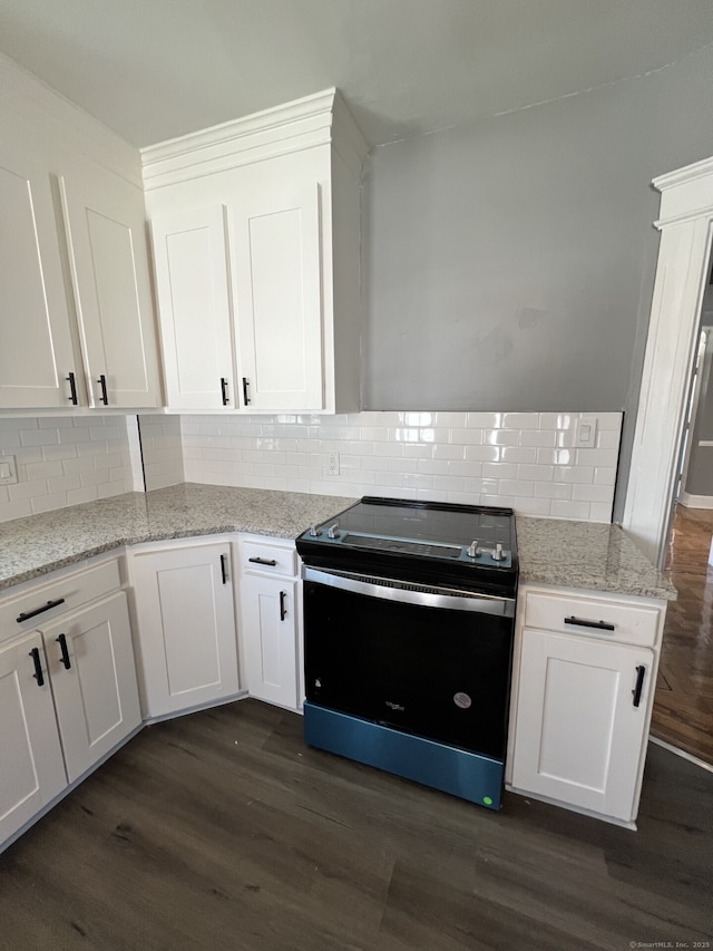 112 Concord St, Waterbury, CT 06710 - kitchen with range with electric cooktop, dark wood-style flooring, decorative backsplash, and white cabinets