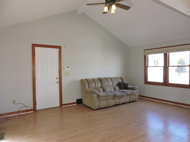 living area featuring baseboards, beam ceiling, light wood-style floors, high vaulted ceiling, and a ceiling fan