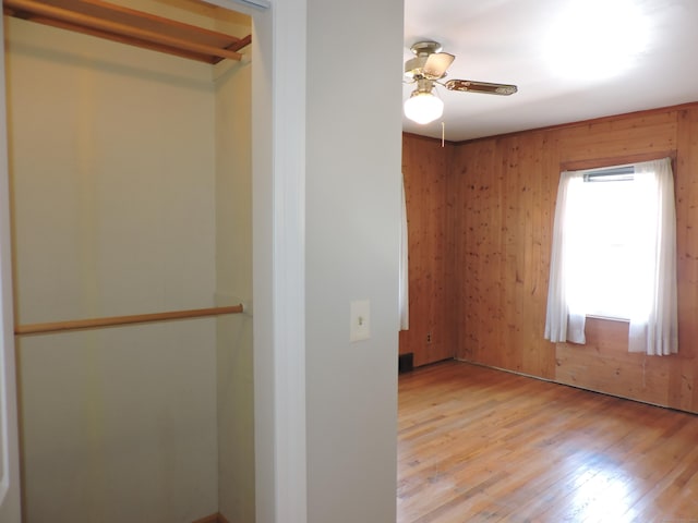 interior space featuring light wood finished floors and ceiling fan