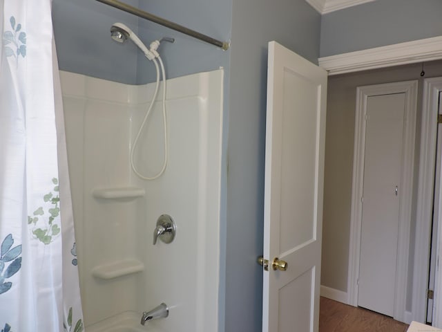 bathroom featuring shower / bath combo with shower curtain