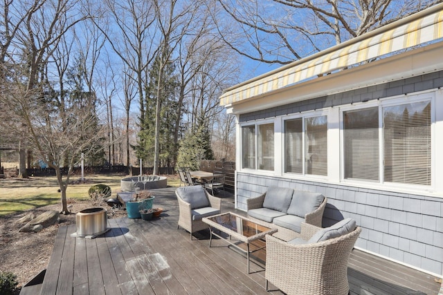 wooden deck featuring outdoor dining space and an outdoor living space