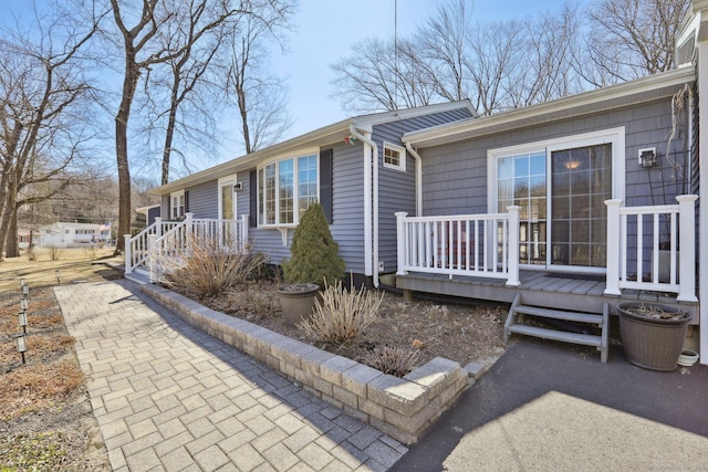 view of front of home with a wooden deck