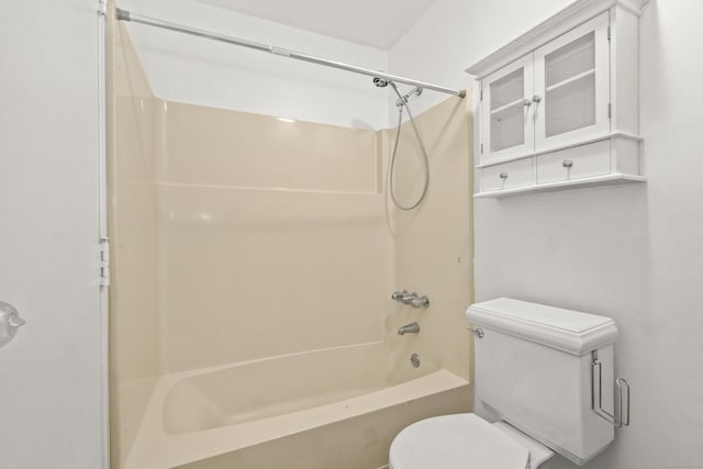 bathroom featuring toilet and shower / bathtub combination