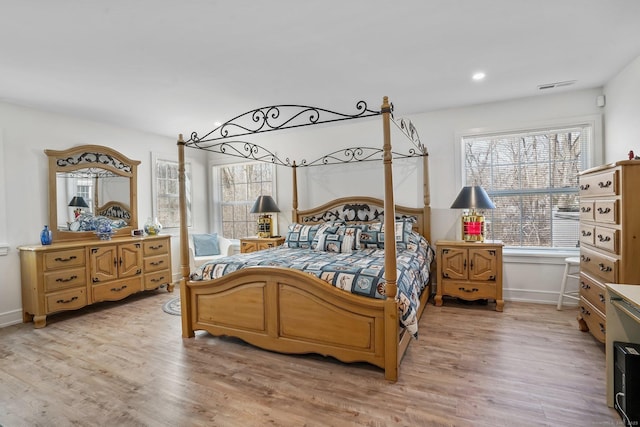 bedroom with visible vents, recessed lighting, baseboards, and light wood-style floors