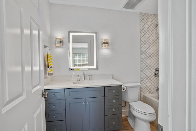 full bathroom featuring visible vents, toilet, shower / bath combination, wood finished floors, and vanity