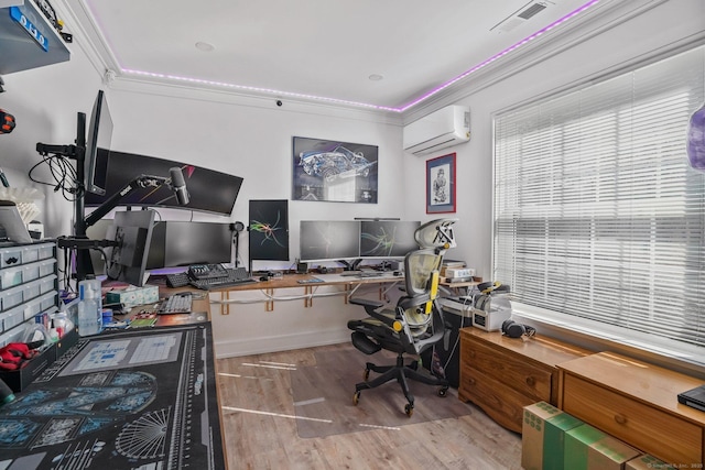 office area featuring visible vents, an AC wall unit, crown molding, and wood finished floors