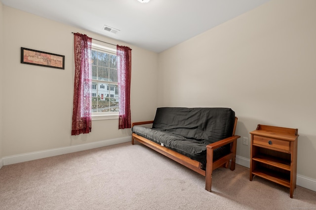 sitting room featuring visible vents, baseboards, and carpet flooring