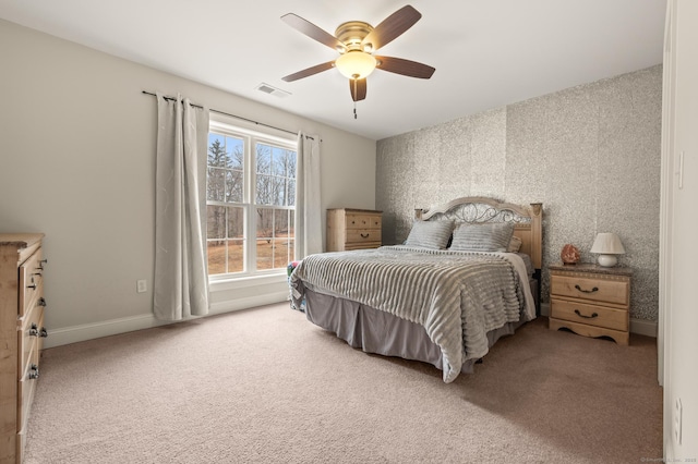 bedroom with visible vents, baseboards, carpet flooring, and wallpapered walls