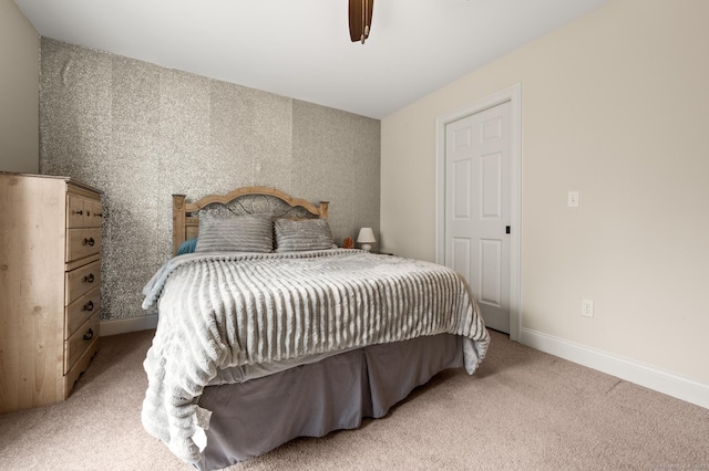 bedroom featuring baseboards, carpet, ceiling fan, and wallpapered walls