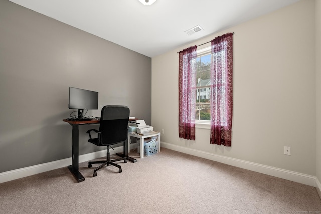 office with visible vents, baseboards, and carpet