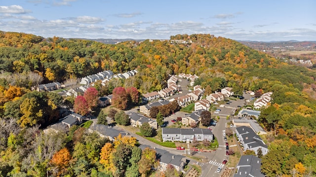 birds eye view of property with a wooded view and a residential view