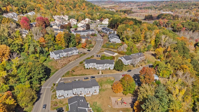 aerial view with a residential view and a wooded view