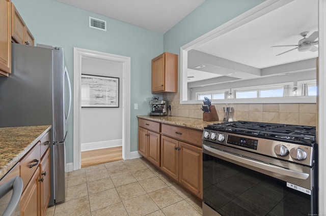 kitchen with backsplash, a ceiling fan, visible vents, and appliances with stainless steel finishes