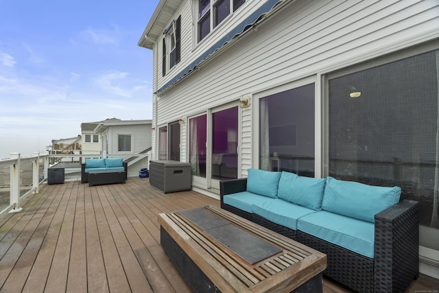 wooden terrace featuring an outdoor hangout area