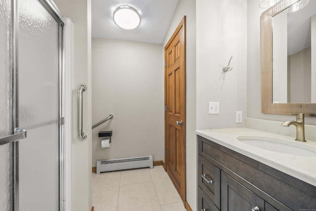 full bath with tile patterned flooring, baseboard heating, vanity, and a shower with shower door