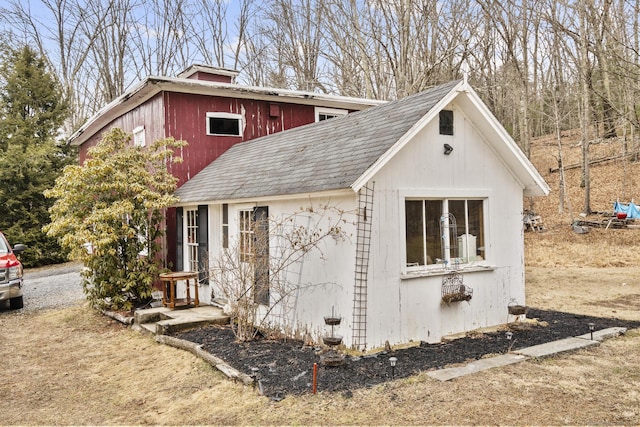 view of front of house featuring roof with shingles