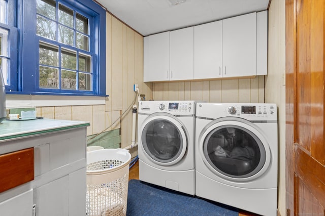 laundry room with cabinet space and washer and clothes dryer