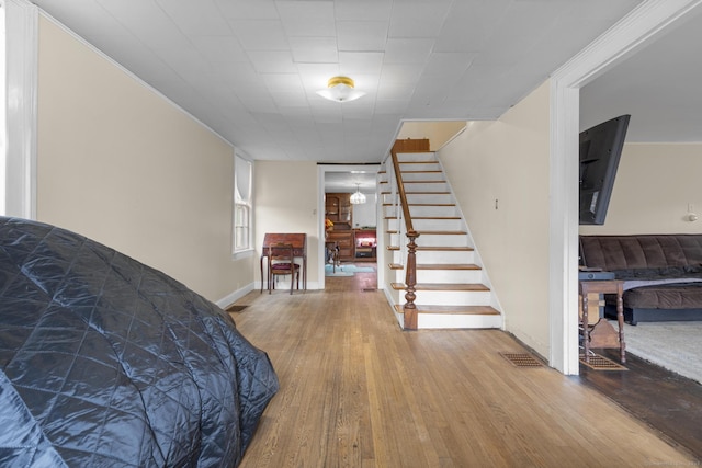 interior space featuring visible vents and wood finished floors