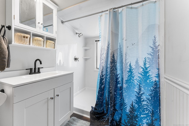 bathroom featuring a stall shower and vanity