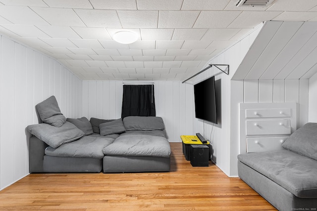 living room with visible vents and light wood-type flooring