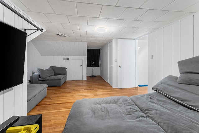 living area featuring visible vents and light wood-style floors