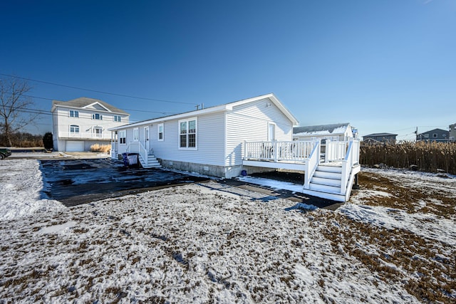 exterior space featuring a wooden deck