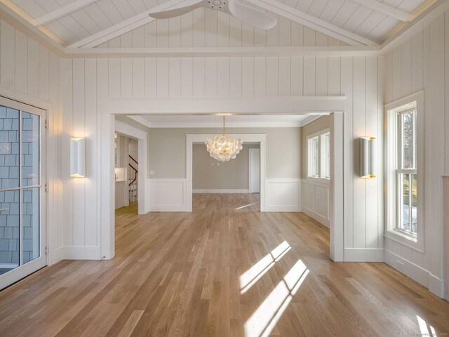 412 Tanner Marsh Rd, Guilford, CT 06437 - spare room featuring a chandelier, a decorative wall, light wood-type flooring, stairs, and wooden ceiling