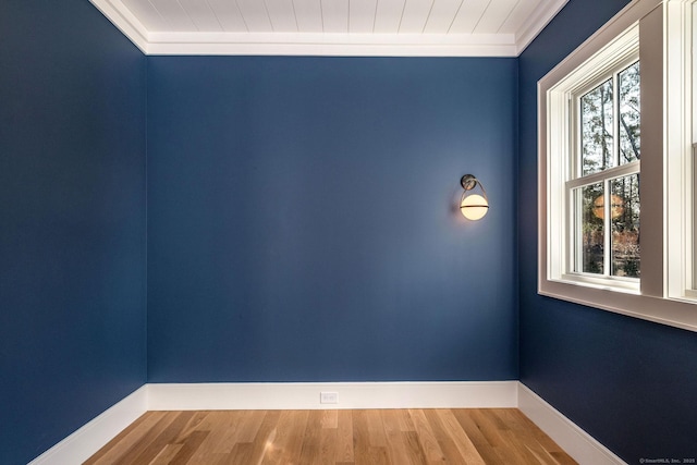412 Tanner Marsh Rd, Guilford, CT 06437 - empty room featuring plenty of natural light, ornamental molding, wood finished floors, and baseboards