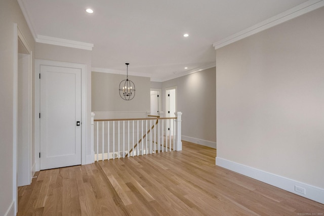 412 Tanner Marsh Rd, Guilford, CT 06437 - spare room with a chandelier, ornamental molding, light wood finished floors, baseboards, and recessed lighting
