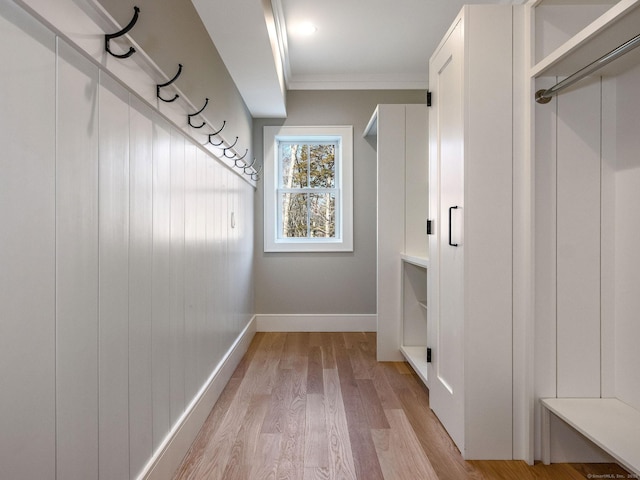 412 Tanner Marsh Rd, Guilford, CT 06437 - mudroom featuring crown molding, baseboards, and light wood finished floors