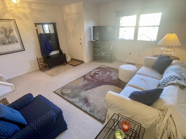 living room with baseboards and carpet floors