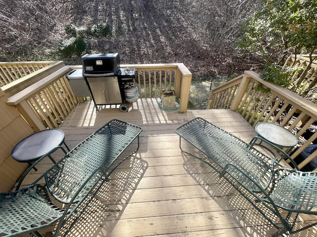 wooden deck with area for grilling