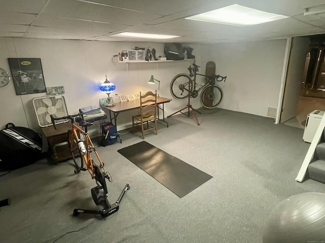 exercise area with visible vents and a drop ceiling