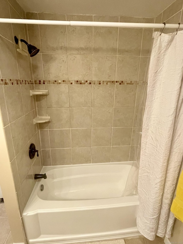 bathroom featuring shower / tub combo with curtain