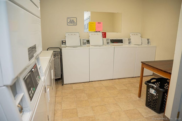 community laundry room featuring washing machine and clothes dryer