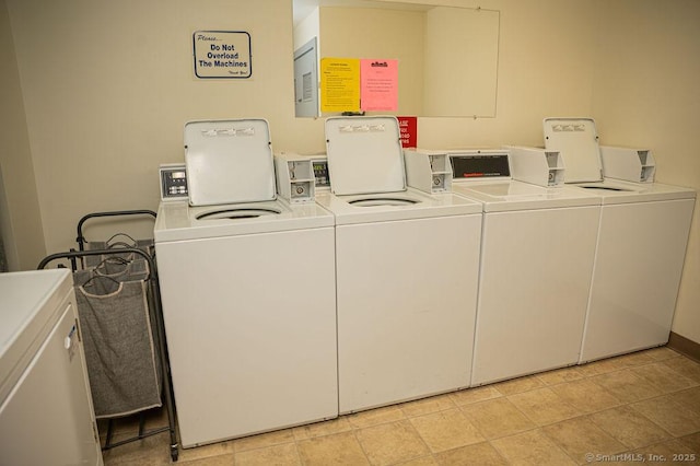 community laundry room with washing machine and dryer