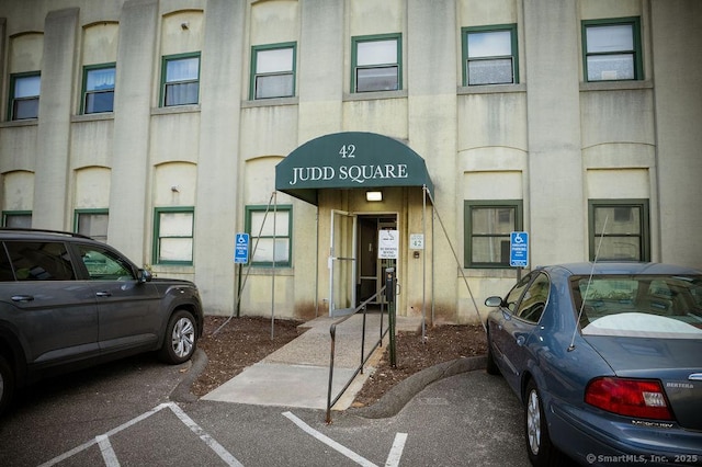 property entrance with uncovered parking