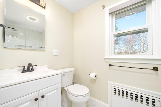 bathroom with toilet, a marble finish shower, radiator, baseboards, and vanity